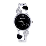 Britique Women's watch with diamond-set heart accents, black dial, quartz movement, stainless steel pin-buckle strap