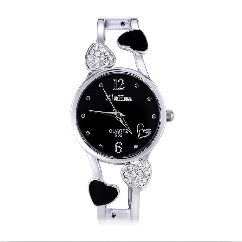 Britique Women's watch with diamond-set heart accents, black dial, quartz movement, stainless steel pin-buckle strap